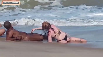 A threesome with a stranger on the beach, including lesbian and interracial elements